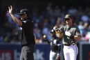 San Diego Padres' Jake Cronenworth, right, points toward the dugout after hitting a double against the Chicago White Sox as umpire Adam Beck calls time in the fourth inning a baseball game Sunday, Oct. 2, 2022, in San Diego.