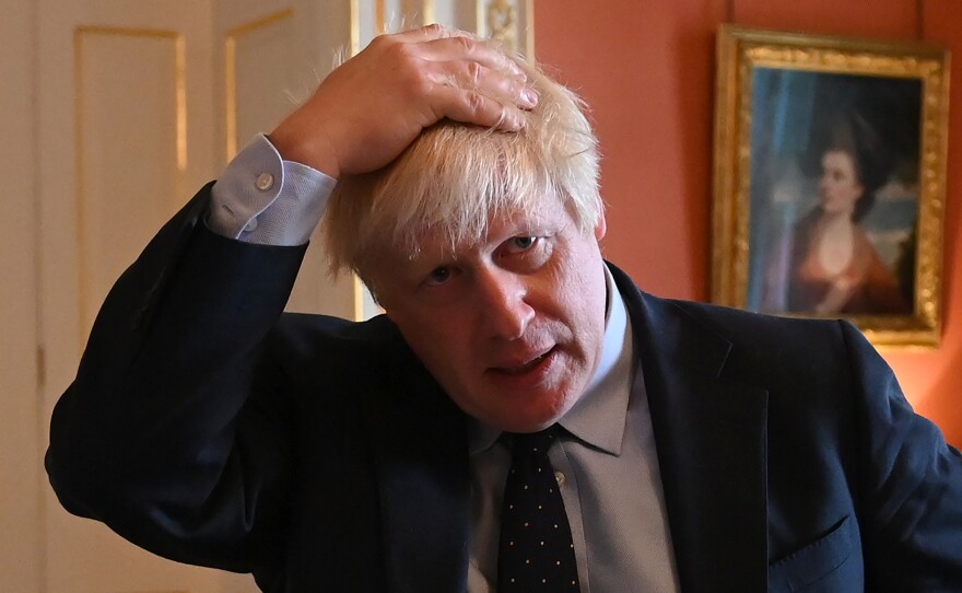 British Prime Minister Boris Johnson, seen hosting health service workers Tuesday at No. 10 Downing St. in London. The same day in the House of Commons, Johnson was dealt a political blow when the defection of a fellow Conservative left him without a working majority in Parliament.