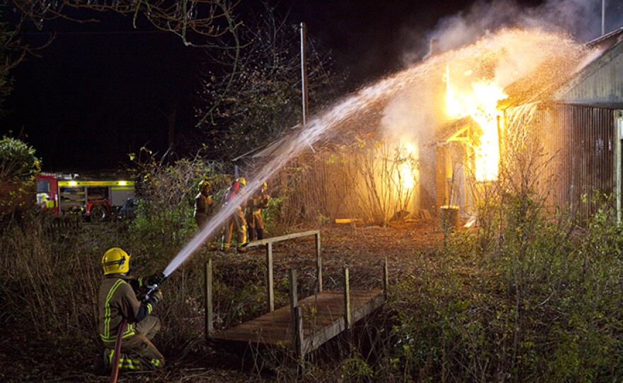Firemen work to put out a fire in a scene from "Murder Of Innocence." When a barrister is killed in Midsomer, suspicion falls on convicted murderer Grady Felton. Grady has just returned to the village of Binwell where he committed a murder years ago amid much anger from locals. But Grady has a solid alibi. Barnaby suspects he is working with an accomplice – until Grady himself is targeted in an arson attack.
