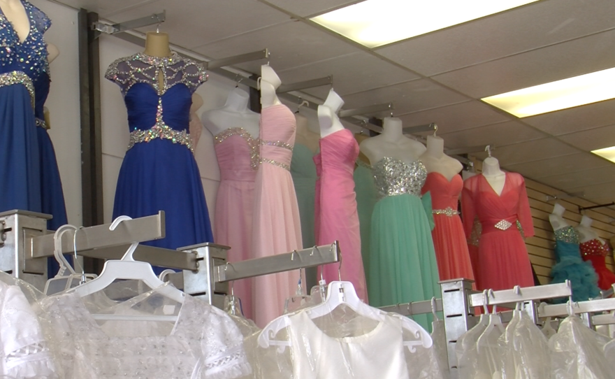 The formal dress shop in San Ysidro, Princesa, has seen a decline in sales due to the weakening peso.