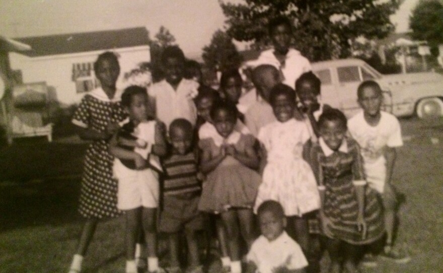 Children in the Truxton neighborhood of Portsmouth, Virg., where professor Brenda Stevenson grew up, pose for a photo.