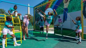 Children activating the installation <em>America's Playground: DC</em> by artist Derrick Adams in Constitution Gardens on the National Mall.