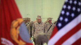 Afghanistan-Marines salute during the playing of the national anthem during a memorial ceremony, Sept. 20. During the ceremony, Marines paid tribute to Sgt. Bradley Atwell, an aircraft electrical, instrument and flight control systems technician with Marine Aviation Logistics Squadron 16, from Kokomo, Ind. Atwell was killed in action while engaging insurgents during an attack on Camp Bastion, Sept. 14.