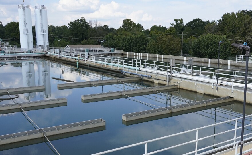 Clouds are reflected off the City of Jackson's O.B. Curtis Water Treatment Facility's sedimentation basins in Ridgeland, Miss., Sept. 2, 2022.