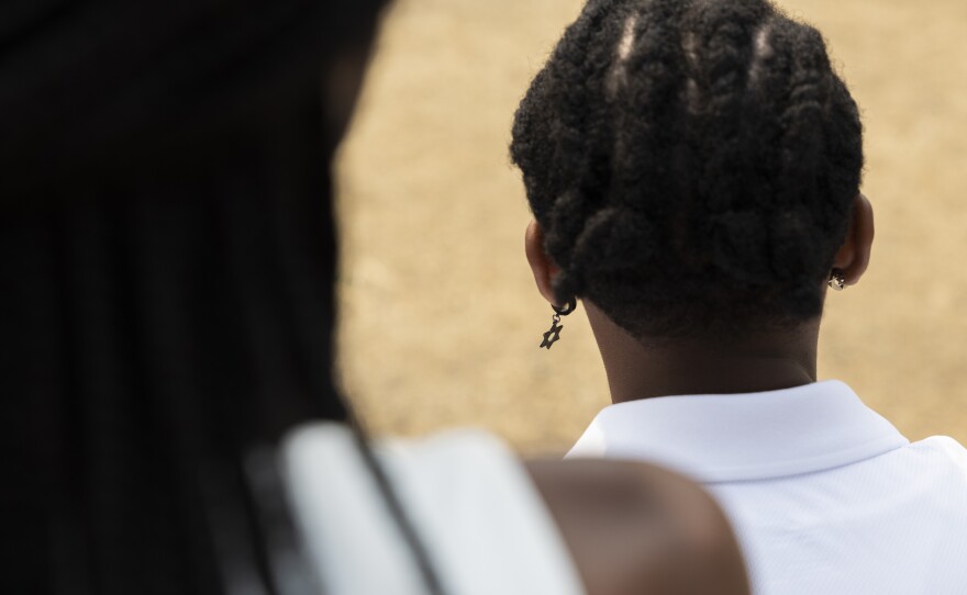Kenya Edelhart wears a Star of David earring in her left ear. She's worn it every day for the past three years because people kept telling wasn't Jewish.