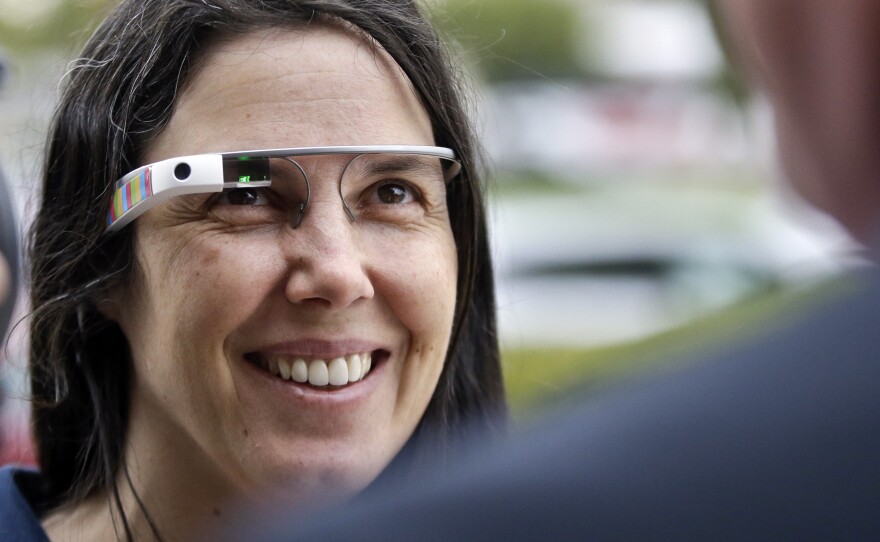 Cecilia Abadie wears her Google Glass as she talks with her attorney outside traffic court in December. A California Highway Patrol officer gave Abadie two citations in October; she was cleared of both infractions Thursday.