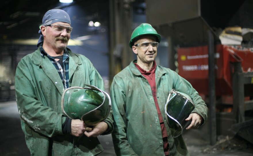 The whole process of pouring of the cast iron is the work of two men: Hensley (left) and Houseman.