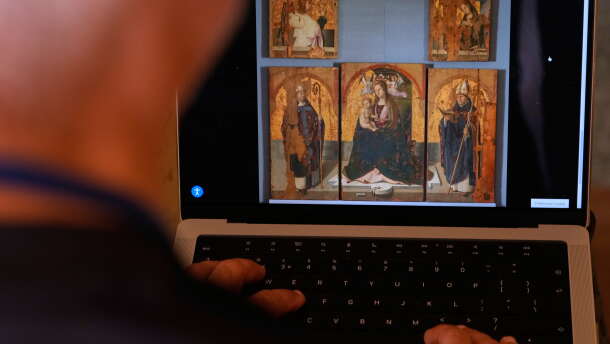A journalist browses the Messina museum website showing a picture of the Early Renaissance painter Antonello da Messina's artwork, multiple pieces of which were stolen from the Sicilian museum on Aug. 15, 2026.