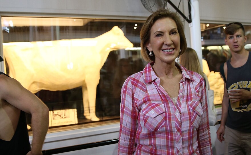 Republican presidential candidate Carly Fiorina poses for a photo in front of the Butter Cow while touring the Iowa State Fair on Monday in Des Moines, Iowa.