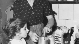 Sterno-type cooking in 1948. Many people still use these cooking tools today when disaster strikes.