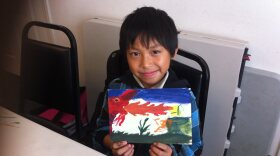 Saw is a young Burmese refugee, he painted a dragon at Karen Organization San Diego's after school program. 