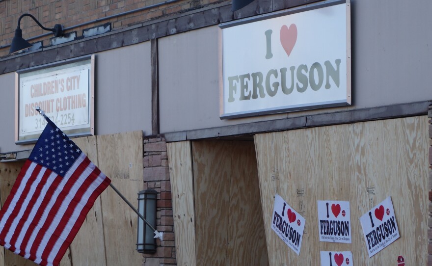 A local business is boarded up in anticipation of another night of unrest in Ferguson, Mo., Tuesday.  A day after people set fire to buildings in the city, President Obama said, "I have no sympathy at all for destroying your own communities."