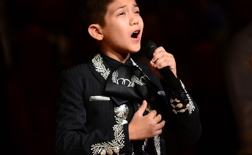 Sebastien De La Cruz, known as San Antonio's Little Mariachi, sings the national anthem prior to the start of Game 4 in the NBA finals on Thursday.