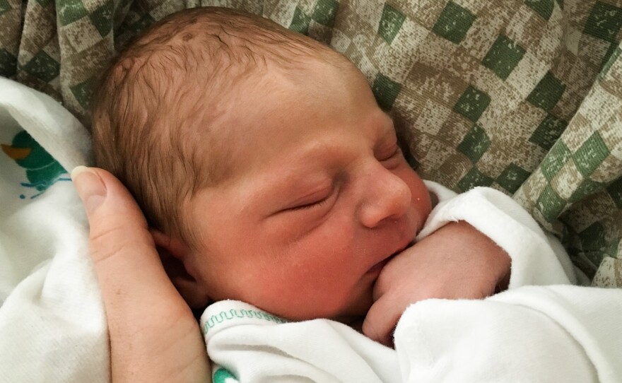 Ethan Thomas gets a cuddle from mom Amy Marks, who used laughing gas during labor.