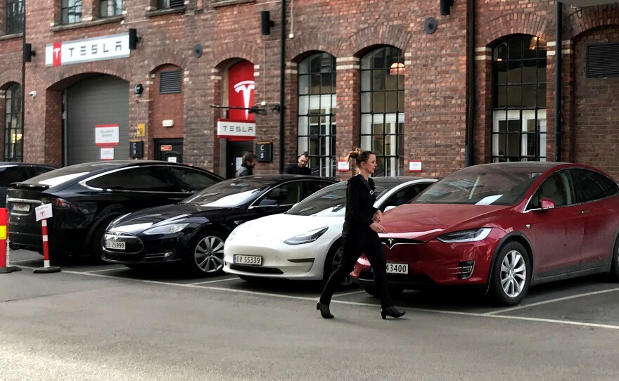 Demand for Tesla Model 3 sedans is driving sales of electric vehicles to new heights in Norway. Here, a Tesla delivery site is seen in Lillestro, Norway.