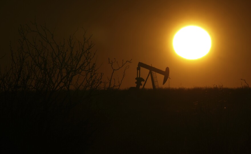 A pumping jack is visible at sunrise on Feb. 24, 2025, in Hobbs, New Mexico.