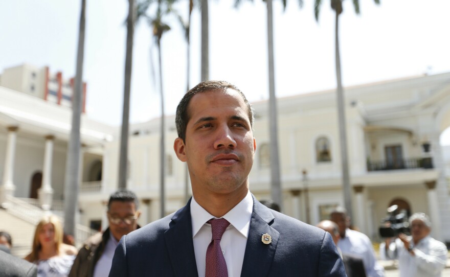 Venezuelan opposition leader Juan Guaidó, who has declared himself interim president, goes to the National Assembly for a meeting with a coalition of opposition parties and civic groups in Caracas on March 18.