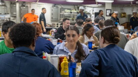 Photo of Rep. Sara Jacobs sitting for a meal with sailors on the mess decks of the USS Abraham Lincoln Sunday, Sept. 27, 2026.