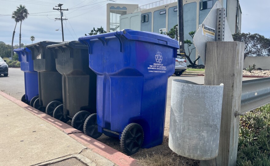 Recycling and trash cans sit curbside in Ocean Beach, San Diego on Sept. 17, 2025.