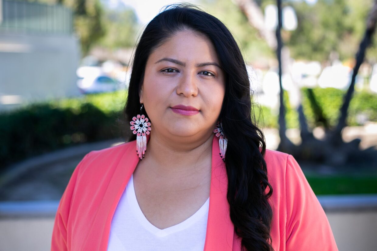 Immigrant rights advocate Lilian Serrano poses in front City Hall in Escondido, Calif., on Feb. 10, 2022.