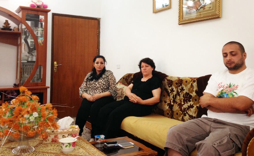 Rinam Mansour (right), his mother (center) and his sister Lillian are among the few people still living in Al-Qoush, a Christian village in northern Iraq.