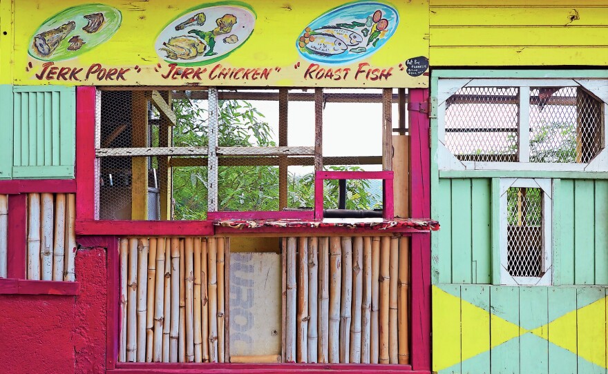 The pillars of Caribbean cuisine, framing the front of a streetside stall.