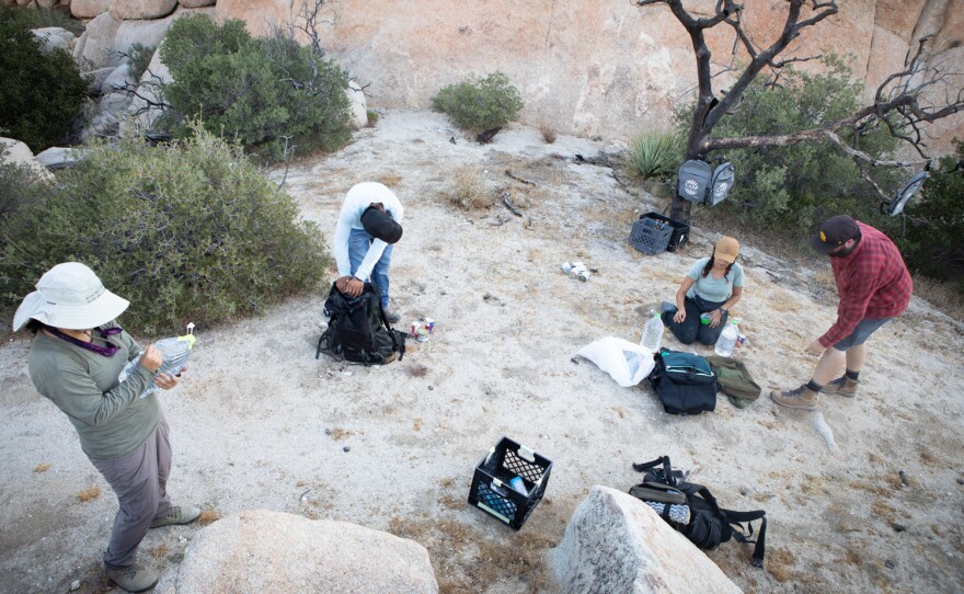 Members of the group Border Kindess drop water and other supplies for migrants in the Jacumba Wilderness, Aug. 13, 2022.