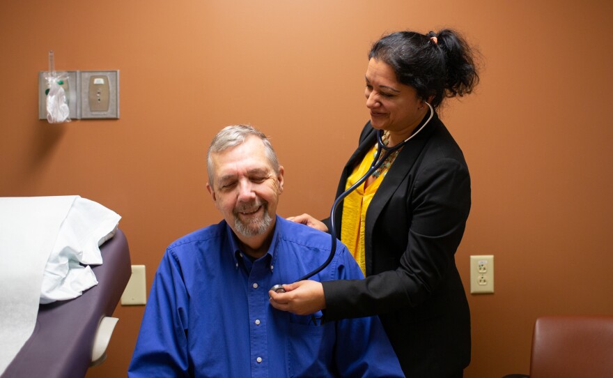 Geriatric oncologist Supriya Gupta Mohile meets with patient Jim Mulcahy at Highland Hospital in Rochester, N.Y. "If I didn't do a geriatric assessment and just looked at a patient I wouldn't have the same information," she says.
