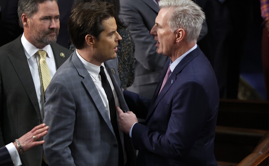 House Republican Leader Kevin McCarthy (R-CA) (L) talks to Rep.-elect Matt Gaetz (R-FL) in the House Chamber after Gaetz voted present during the fourth day of voting for Speaker of the House.