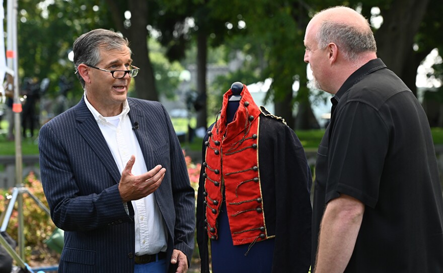 Joel Bohy (left) appraises an identified New York militia coatee, ca. 1812, in Sands Point, N.Y.