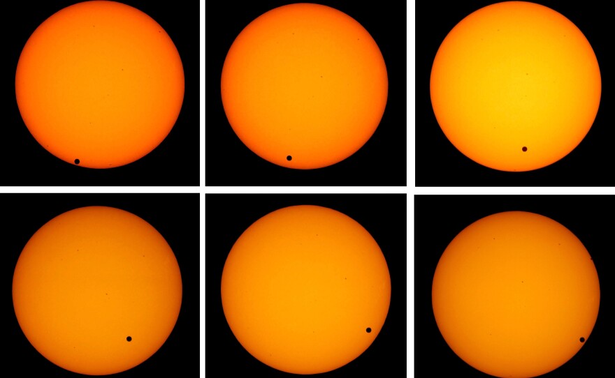 <strong>The Transit Of Venus:</strong> The planet Venus appears as a tiny black dot as it transits across the face of the sun on June 8, 2004. The rare astronomical event will take place again on June 5, 2012.