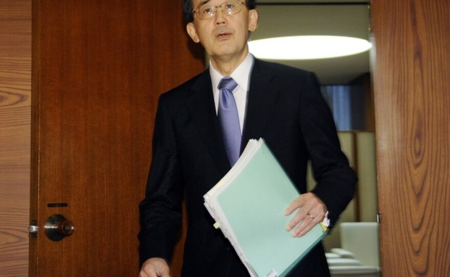 Bank of Japan Governor Masaaki Shirakawa prepares to address reporters in Tokyo on Tuesday after the central bank decided to cut rates.