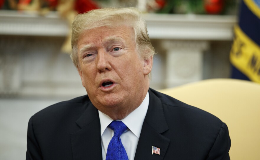 President Trump speaks during a meeting with Democratic congressional leaders in the Oval Office on Tuesday.