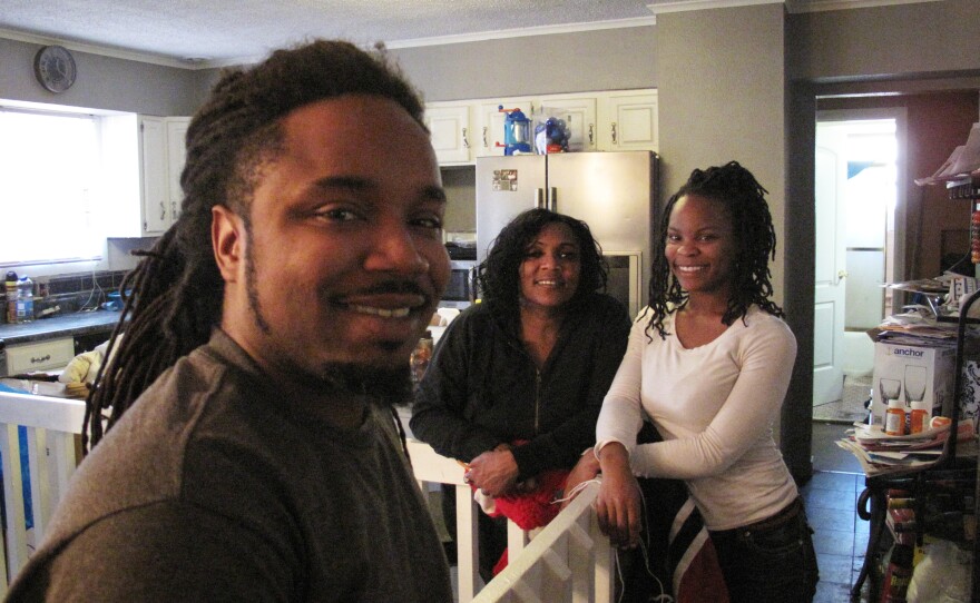 Tonya DeBerry (center) and her children, Herbert Nelson and Allison Nelson, have all been held in Ferguson and Jennings jails for unpaid traffic tickets.