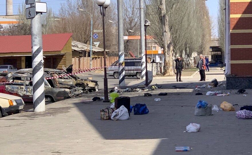 Personal belongings of victims and burned vehicles are seen after an alleged rocket attack Friday at the railway station in the eastern city of Kramatorsk, Ukraine.