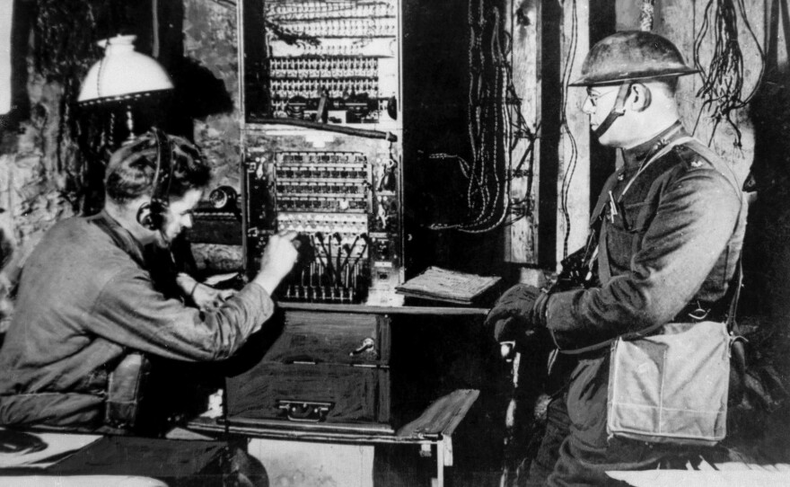 U.S. soldiers operate a radio switchboard just behind the front line during World War I. The U.S. government banned private radio in America during the war. However, the government poured millions into research, which helped advance the industry and led to the rise of commercial radio stations after the war, when the ban was lifted.