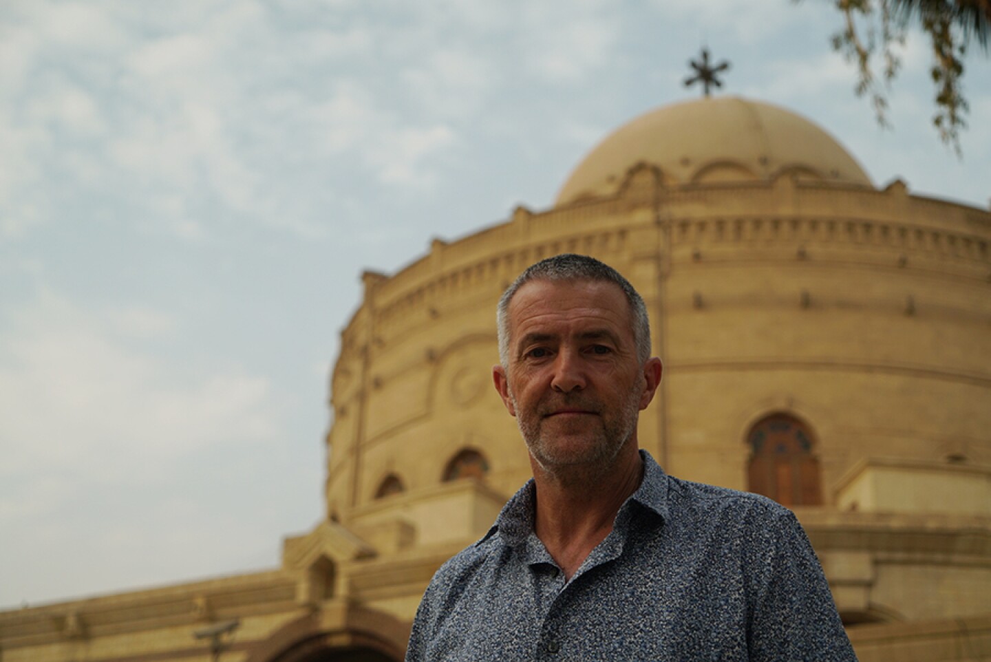 Contributor Peter Sheehan in front of the Greek Orthodox Church of St. George, Cairo.