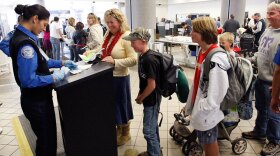 Air travelers pass through security at Los Angeles International Airport (LAX)  on Monday in Los Angeles, Calif.