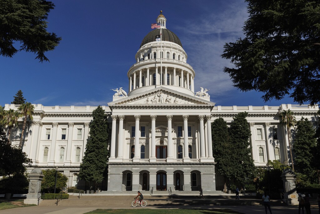 People walk around the California State Capitol, Aug. 5, 2024, in Sacramento, Calif.