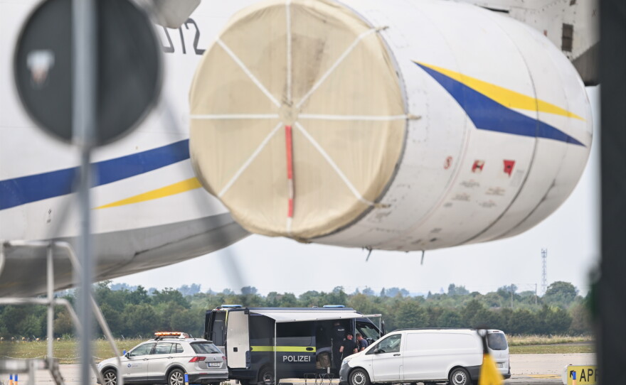 Police forensic technicians work near a Ukrainian aircraft at Leipzig/Halle Airport, where a drone with an explosive device was found and a detonator was removed from the object, in Schkeuditz, Germany, Wednesday Aug. 5, 2026.