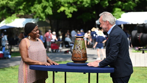 Nick Dawes (right) appraises a Mougin Frères pottery vase, ca. 1930, in Baltimore, Md. ANTIQUES ROADSHOW “Maryland Zoo, Hour 2” airs Monday, April 21 at 8/7C PM on PBS.