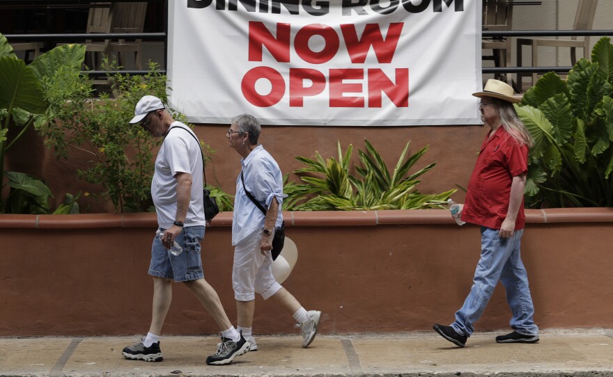 Texas has seen a recent uptick in the number of COVID-19 cases, with a record level of new cases and hospitalizations announced Tuesday. People are seen here  Monday along the San Antonio River Walk.