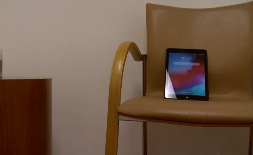An iPad sits a room at La Maestra Community Health Center in City Heights where people seeking addiction treatment can meet with their doctor virtually, Oct. 6, 2020.