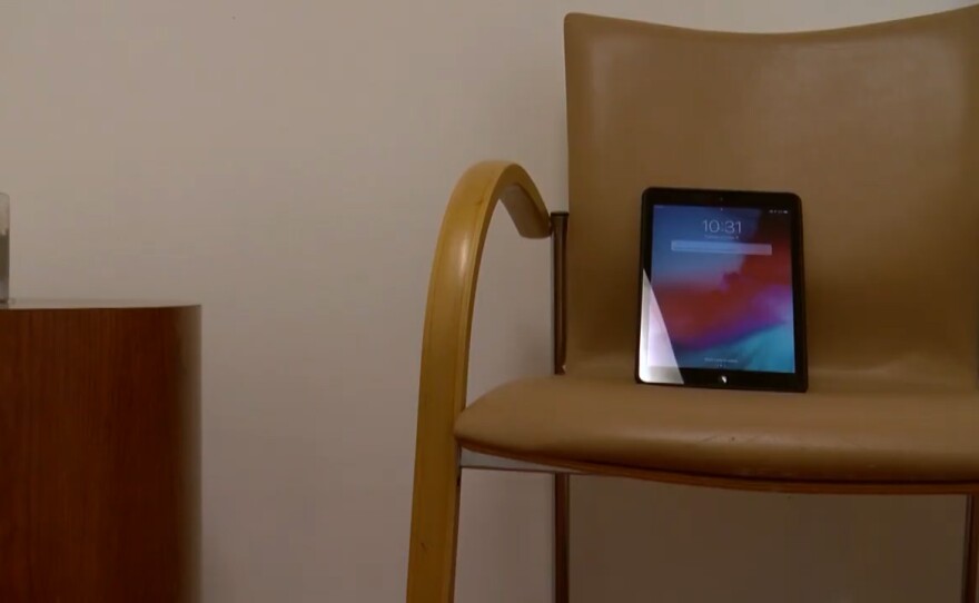 An iPad sits a room at La Maestra Community Health Center in City Heights where people seeking addiction treatment can meet with their doctor virtually, Oct. 6, 2020. 