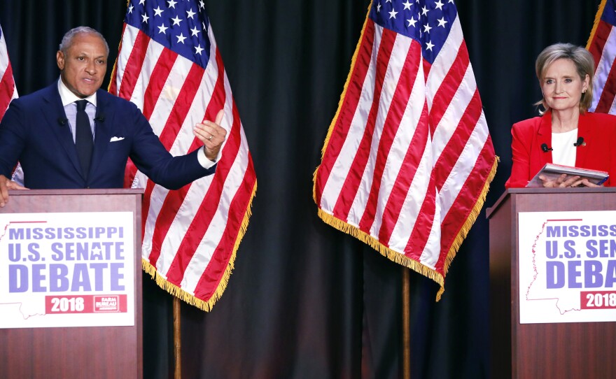 Democrat Mike Espy and Republican Sen. Cindy Hyde-Smith participate in a televised Senate debate Tuesday night in Jackson, Miss.