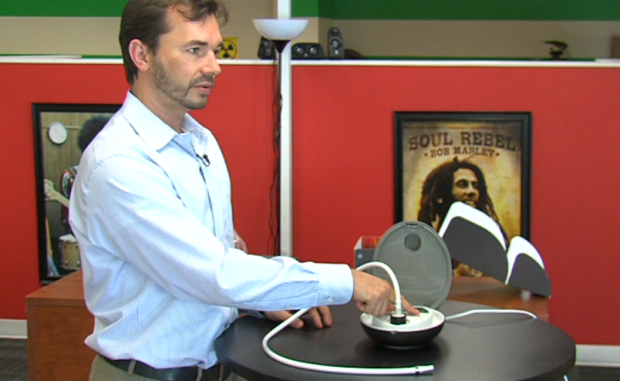 Josh Young demonstrates the temperature control feature on the Herbalizer. April 30, 2014.