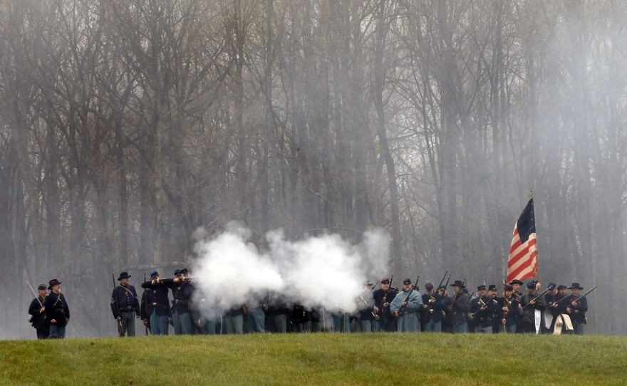 Historical re-enactors recreate the Battle of Appomattox Courthouse as part of the 150th anniversary of the surrender of the Army of Northern Virginia at Appomattox Court House.