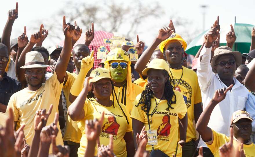 Supporters of Zimbabwe's main opposition, the Citizens Coalition for Change (CCC), raise their fingers to symbolize change at a rally addressed by presidential candidate Nelson Chamisa at White City Stadium on Sunday in Bulawayo, Zimbabwe, ahead of general elections on Wednesday.