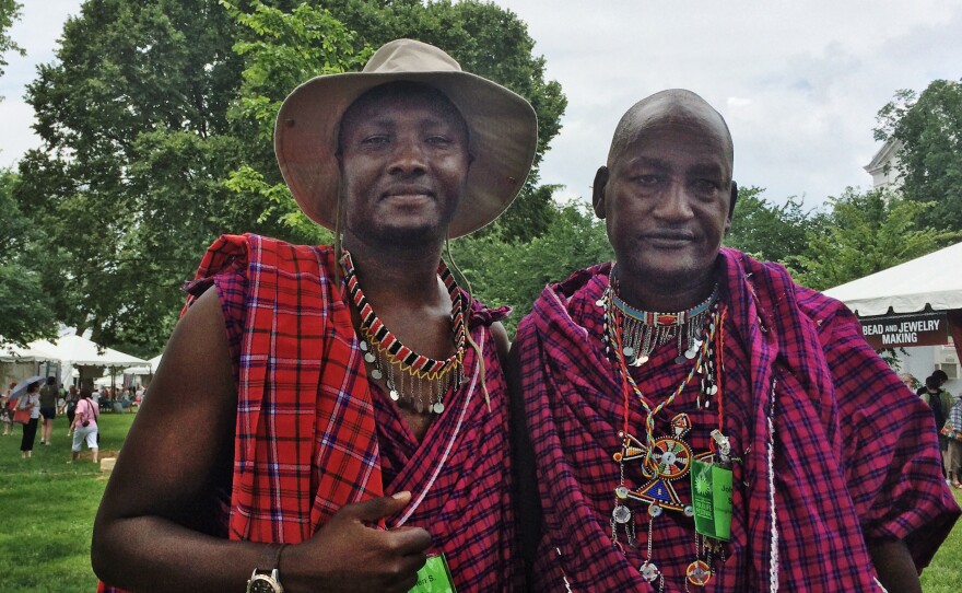 Maasai member Stephen Moiko (left) and junior elder Johnson Sipitiek pose for the camera at this summer's Smithsonian Folklife Festival.