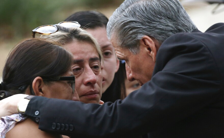 The archbishop of San Antonio, Gustavo Garcia-Siller, comforts families outside the Civic Center following a deadly school shooting at Robb Elementary School in Uvalde, Texas, Tuesday, May 24, 2022.